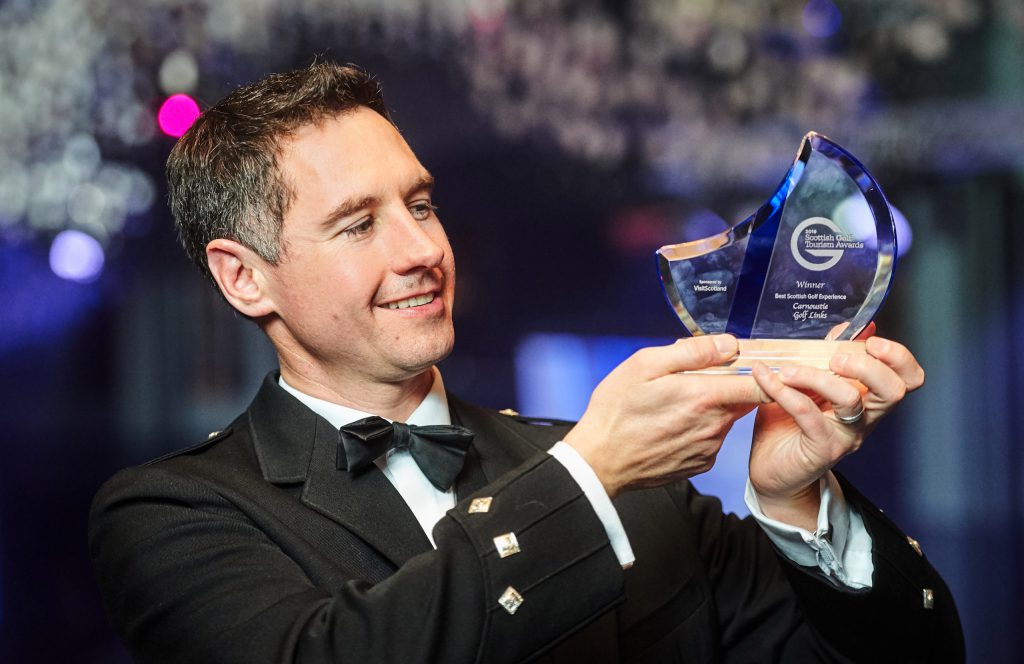 Michael-Wells-the-chief-executive-of-Carnoustie-Golf-Links-with-the-Scotlands-Best-Golf-Experience-awardJPG